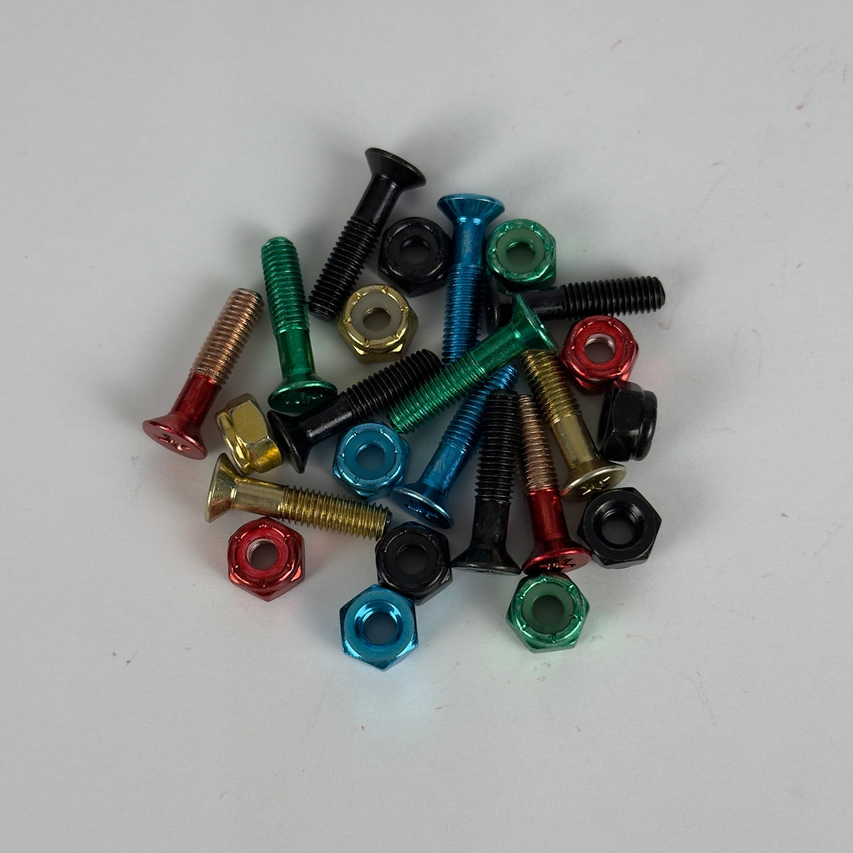 Pile of colored skate bolts and nuts